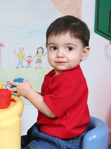 KRSS Services - Image of boy with playdoh