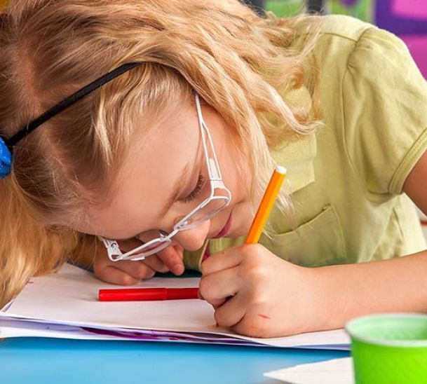 Girl writing on page